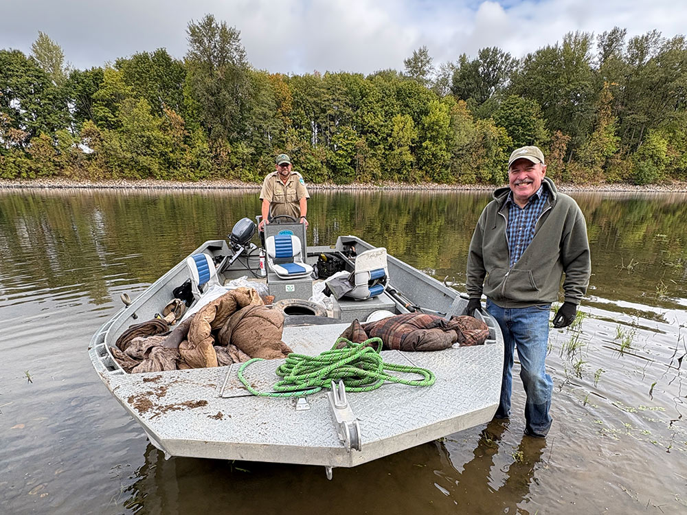 Ranger-and-Gordon-cropped Ranger and Gordon by boat in river